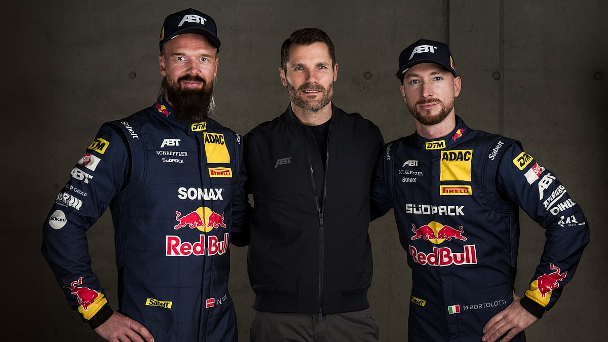 Sebastian Marko / Red Bull Content Pool : (L-R) Nicki Thiim of Denmark, Martin Tomczyk of Germany, ABT Motorsport director, and Mirko Bortolotti of Italy pose for a photograph prior to the DTM Team ABT Sportsline reveal of their cars and drivers for the 2025 season in Hochgurgl, Austria on February 17 2025