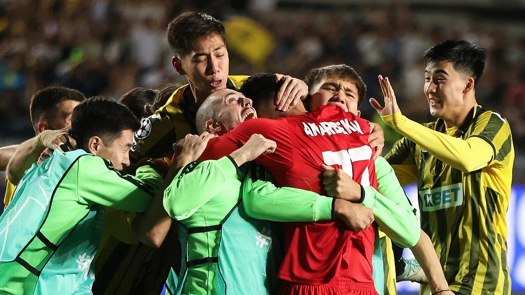 Photo: AP : Kairat Vs Celtic Highlights, UEFA Champions League Playoff: Home team players embrace goalkeeper Temirlan Anarbekov after winning the penalty shootout in Almaty.