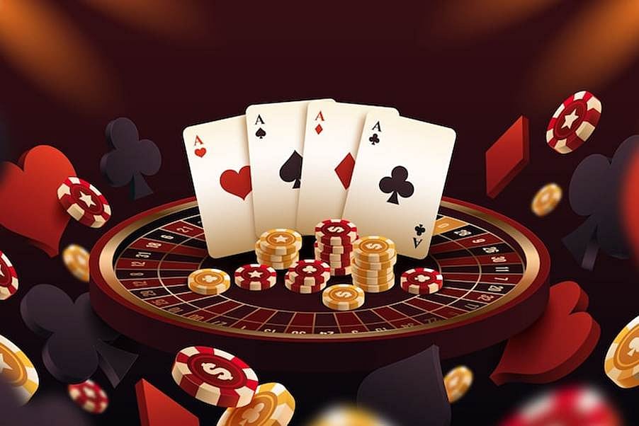 Casino cards and coins on roulette wheel