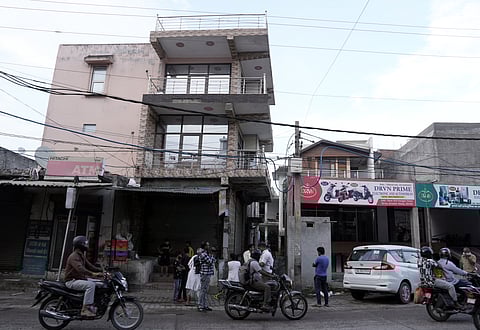 House of Accused Vipin Bhati surrounded by locals and media. (Sirsa, Greater Noida)