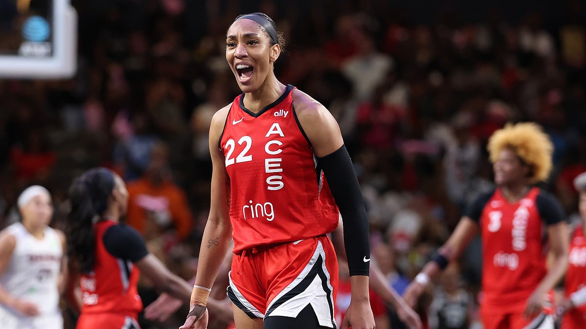 A'ja Wilson #22 of the Las Vegas Aces reacts after a basket and a foul by Chelsea Gray #12 against the Atlanta Dream during the fourth quarter at Gateway Center Arena on August 27, 2025 in College Park, Georgia.