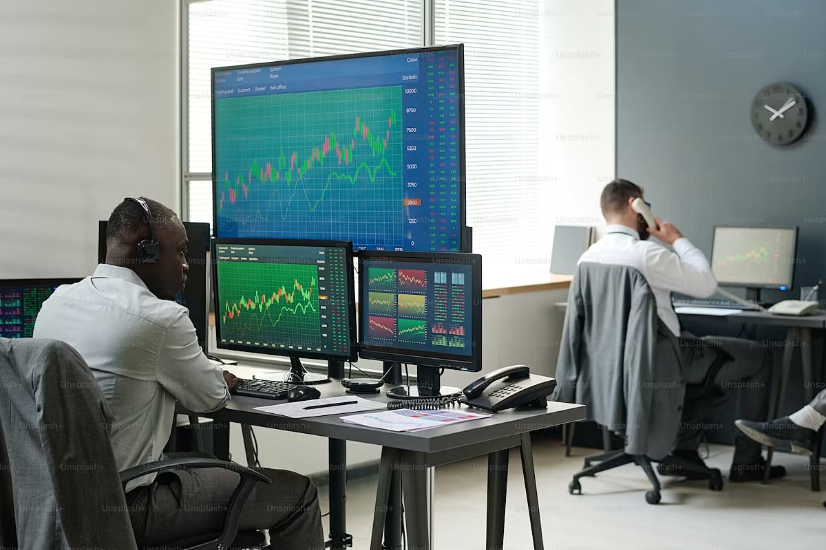 2 men are working on their Systems