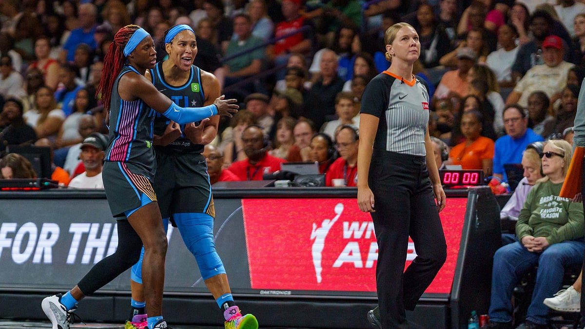 Rhyne Howard #10 holds back Brionna Jones #24 of the Atlanta Dream as she yells at the official during a game between the Dallas Wings and Atlanta Dream at Gateway Center Arena on August 29, 2025 in College Park, Georgia.