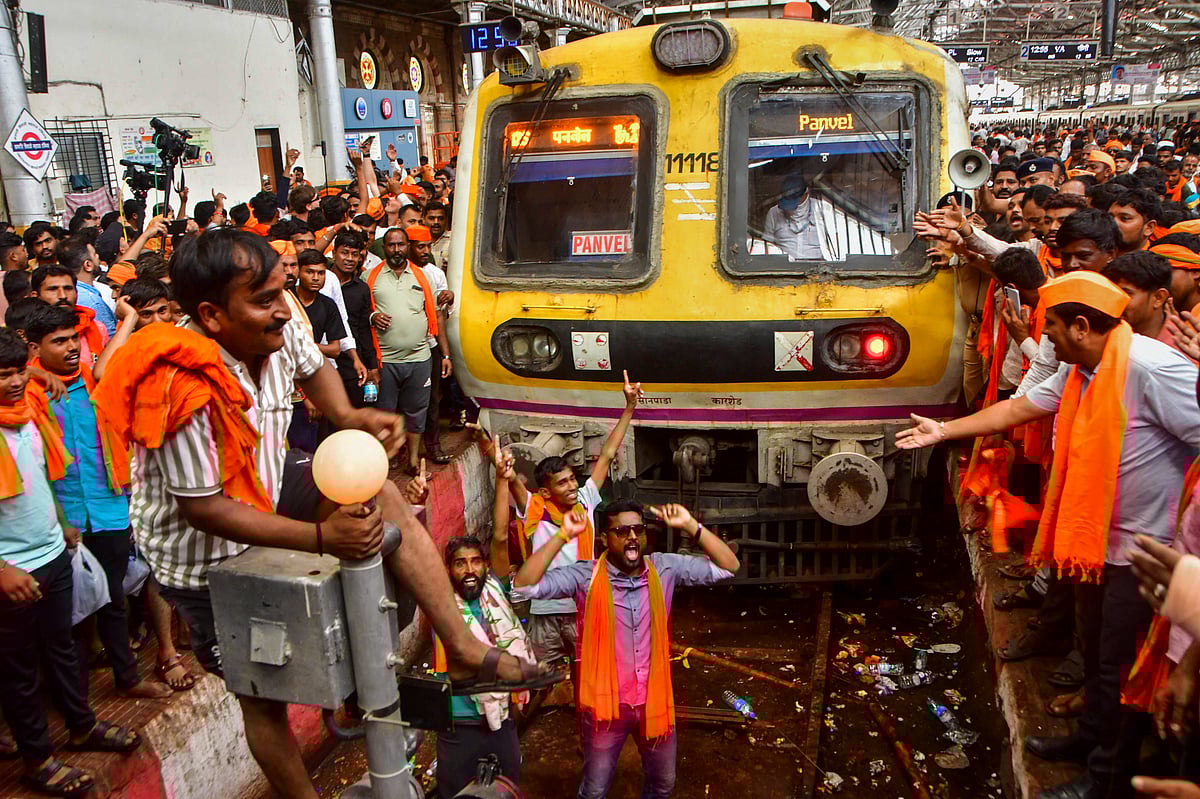Maratha community members stop a train during their protest seeking reservation for the community under the Other Backward Classes (OBC) category, at Chhatrapati Shivaji Maharaj Terminus (CSMT) in Mumbai, Monday, Sept. 1, 2025.