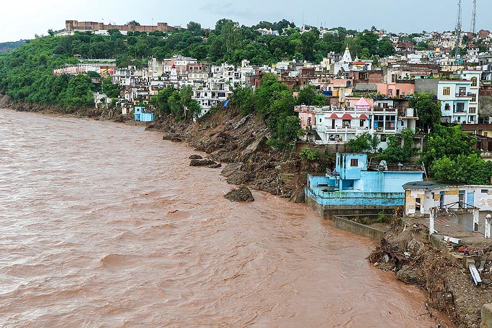 | Photo: PTI : Weather: Swollen Tawi river in Jammu
