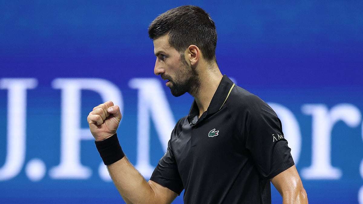 Novak Djokovic celebrates a point against Taylor Fritz