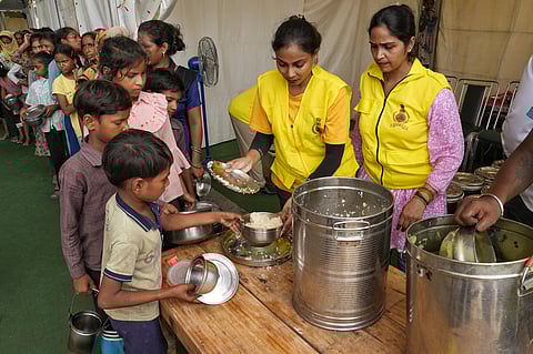 NGO volunteers distributing food to the displaced. 