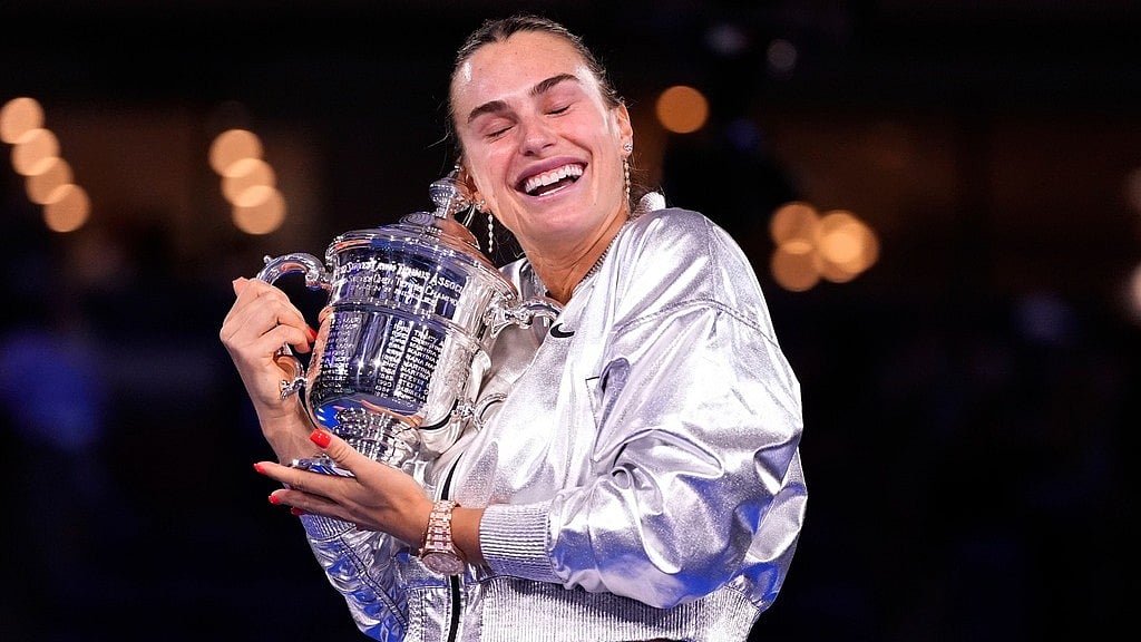 Photo: AP : Aryna Sabalenka Vs Amanda Anisimova Highlights, US Open Final: The world no. 1 holds her trophy after winning the match in New York.
