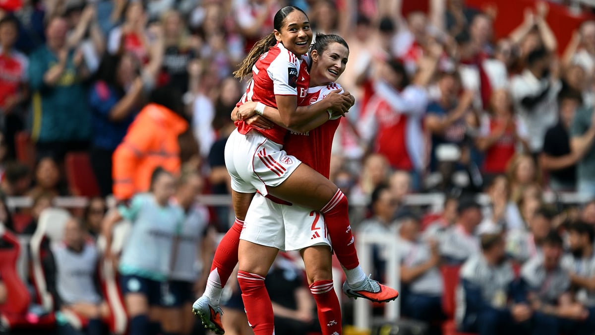 Olivia Smith celebrates her goal with Emily Fox