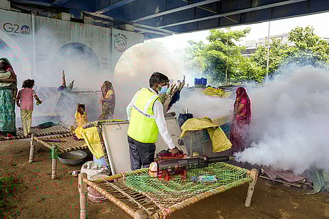 Flood-hit people take shelter under flyovers in Delhi