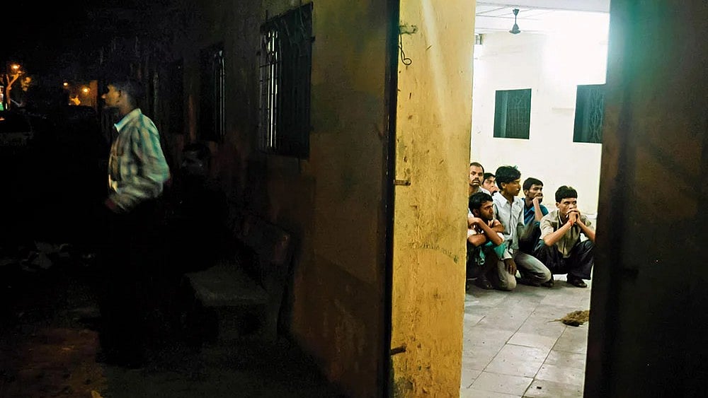 Mumbai train blast suspects rounded up for interrogation at a police station