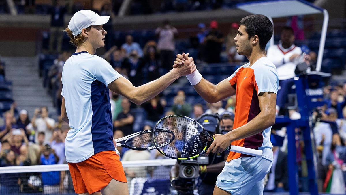 Jannik Sinner and Carlos Alcaraz greet each other at the net after their epic US Open quarter-final battle in 2022.
