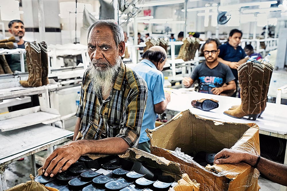 | Photo: AP : Hard Hit by Tariffs: Workers at a leather footwear manufacturing unit in Agra 