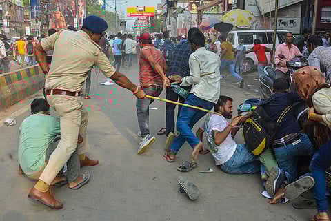Police personnel baton charge to disperse protest
