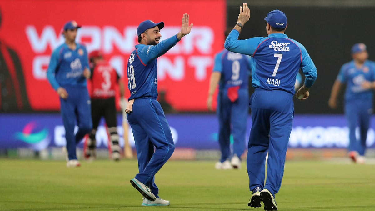 X/Afghanistan Cricket Board : Afghanistan Vs Hong Kong, Asia Cup T20: Rashid Khan (left) celebrates a wicket with Mohammad Nabi in Abu Dhabi.