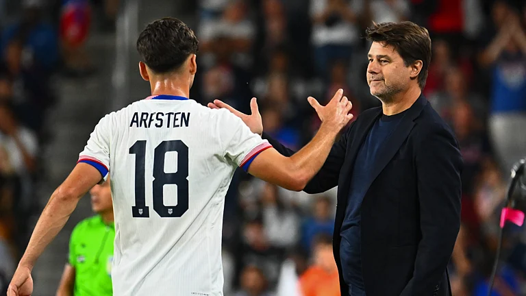 United States boss Mauricio Pochettino shares a handshake with Max Arfsten - null