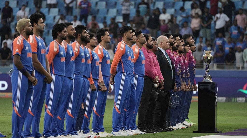 India's players and United Arab Emirates players stand for their national anthem during the Asia Cup - AP/Fatima Shbair