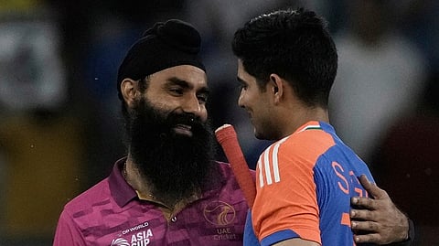 United Arab Emirates's Simranjeet Singh, left, talks with India's Shubman Gill after India won the match during the Asia Cup Cricket match between United Arab Emirates and India at Dubai International Cricket stadium in Dubai, United Arab Emirates, Wednesday.