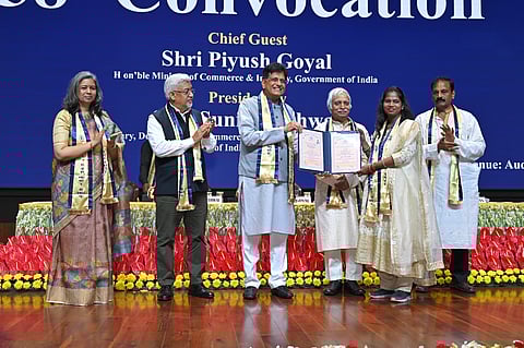 Shri Piyush Goyal awarding a student with her degree
