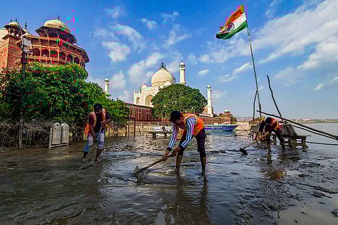 Cleaning work after recession of Yamuna water