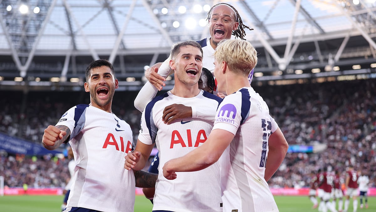 Xavi Simons celebrates with his Tottenham team-mates