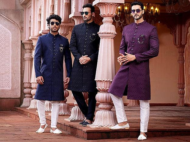 Three men in traditional Indian kurtas.