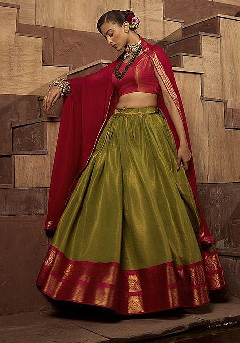 A woman in a vibrant silk lehenga choli.