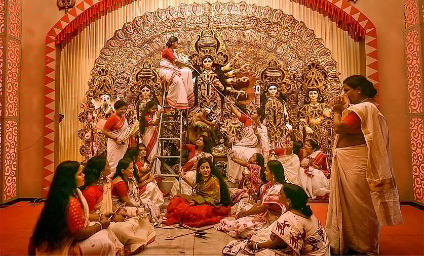 A group of women decorating Durga pandal for durga puja