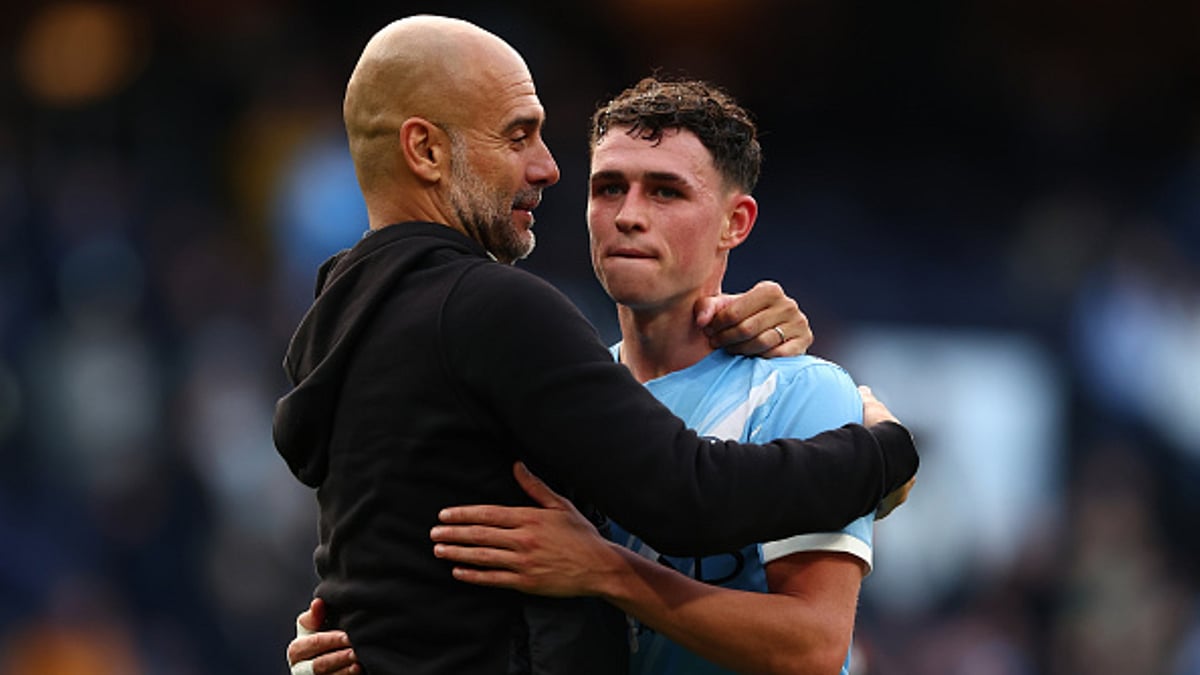 Guardiola embraces Foden after Manchester derby win