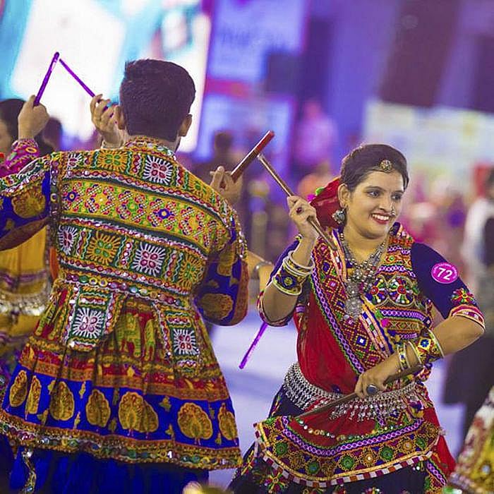 Garba dancers playing garba at dandiya nights