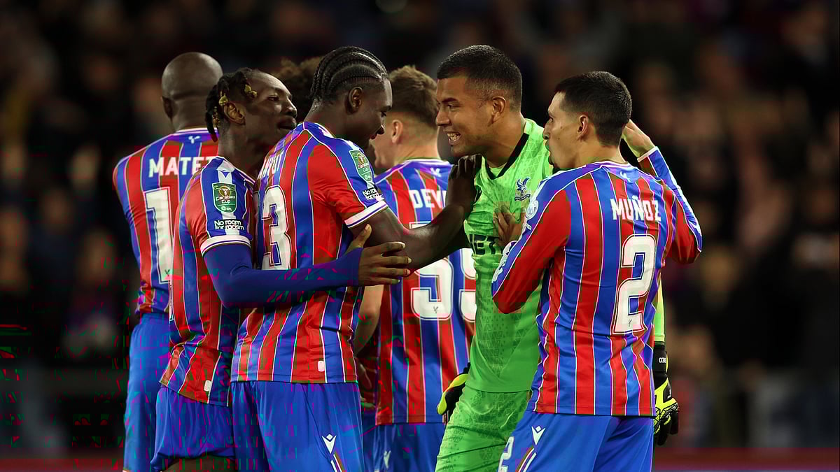 Crystal Palace players celebrate with shoot-out hero Walter Benitez on Tuesday