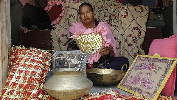 (Photo by Thierry Falise/LightRocket via Getty Images)_ : Balwant Kaur, 30, with the objects from her dowry which, thanks to the intervention of an NGO, she could get back from her in-laws who were treating her as slave. (REPRESENTATIONAL IMAGE)