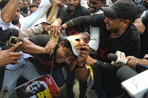 The decoy being pushed and pulled by the protestors. 