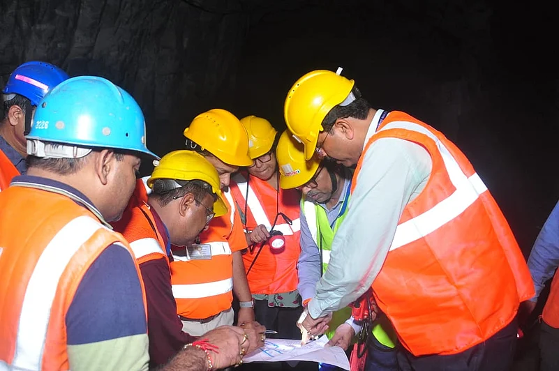 HCL workers in uniform discussing plans