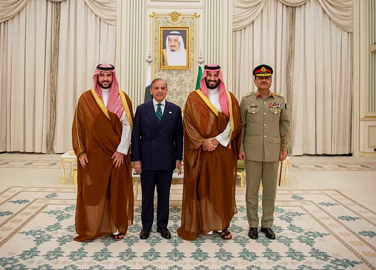In this photo released by Pakistan's Press Information Department, Saudi Arabia's Crown Prince Mohammed bin Salman, second right, Saudi Arabia's Defence Minister Khalid bin Salman, left, Pakistan's Prime Minister Shehbaz Sharif, second left, and Pakistan's Army Chief Field Marshal Asim Munir, pose for photographs after signing a mutual defense pact, in Riyadh, Saudi Arabia, Wednesday, Sept. 17, 2025. - Press Information Department via AP