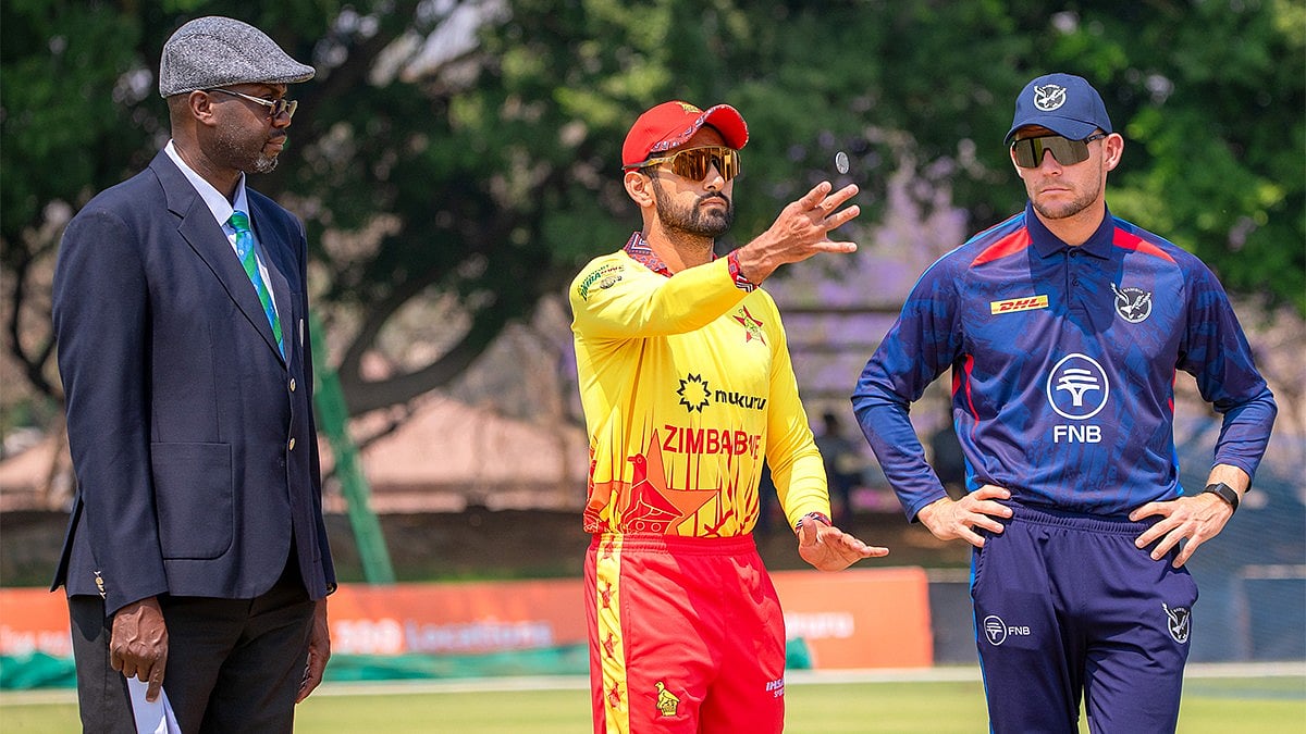 X/Zimbabwe Cricket : Zimbabwe Vs Namibia Live Streaming, 3rd T20I: Captains Sikandar Raza (centre) and Gerhard Erasmus at the toss in Bulawayo.