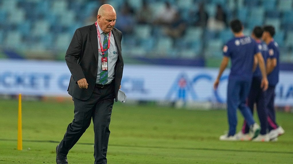 AP : Match referee Andy Pycroft walks back after the toss during the Asia Cup cricket match between Pakistan and United Arab Emirates at Dubai International Cricket Stadium.