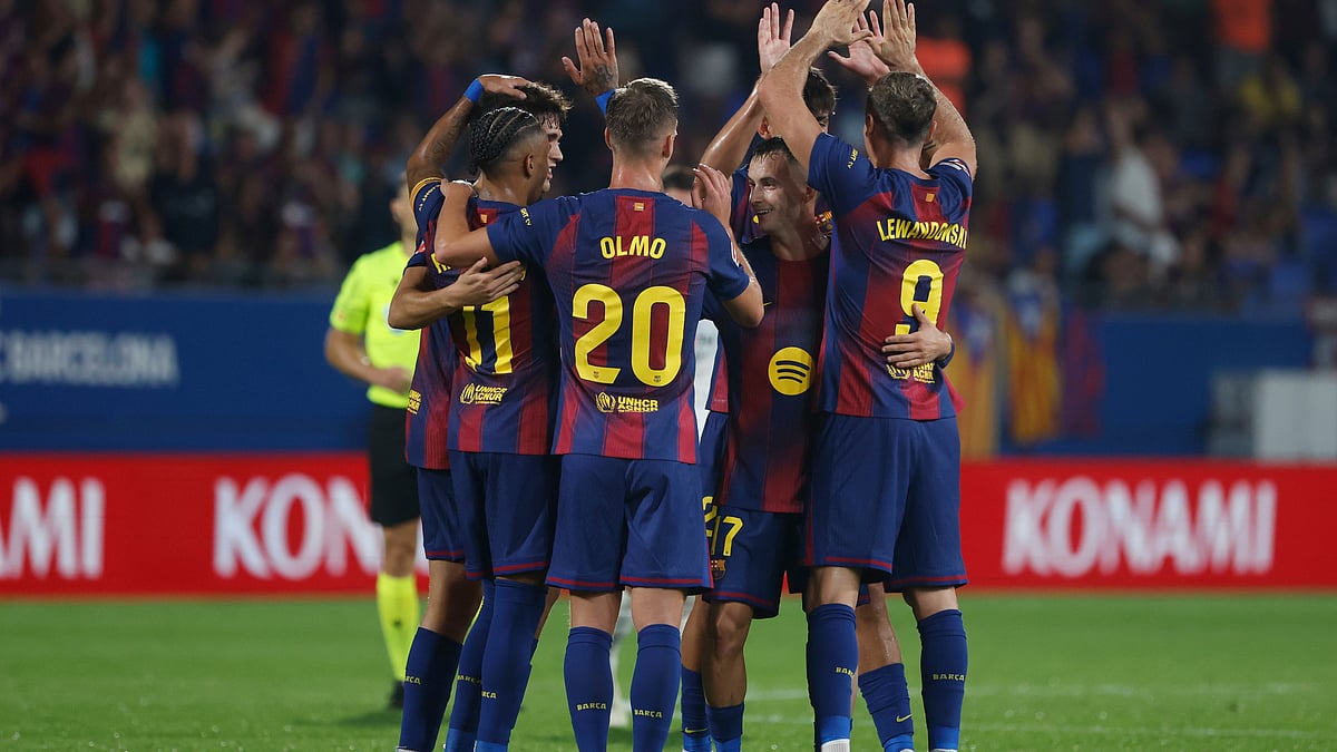 | Photo: AP/Joan Monfort : Barcelona's Robert Lewandowski, right, is congratulated after the VAR confirmed his side's 6th goal during a Spanish La Liga soccer match between FC Barcelona and Valencia at the Johan Cruyff stadium in Barcelona, Spain, Sunday, Sept. 14, 2025.