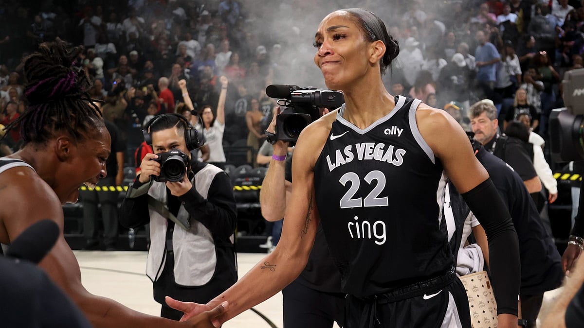 Chelsea Gray #12 and A'ja Wilson #22 of the Las Vegas Aces celebrate a 74-73 victory against the Seattle Storm in Game Three of the 2025 WNBA Playoffs first round at Michelob ULTRA Arena on September 18, 2025 in Las Vegas, Nevada.
