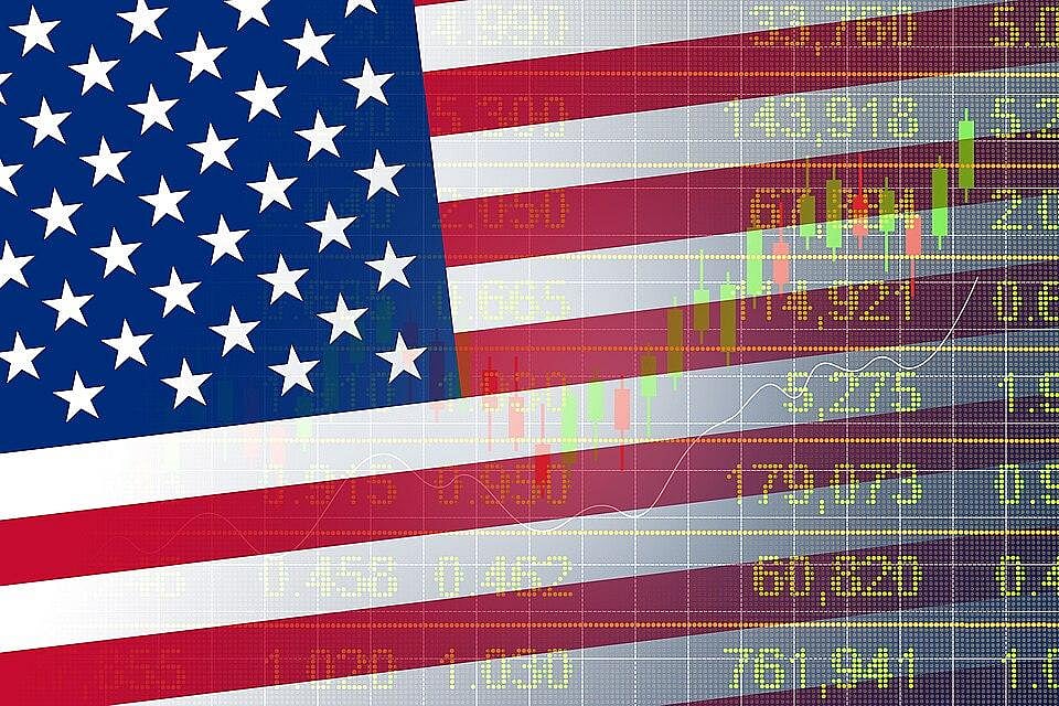 American flag overlaid with stock market data and charts.