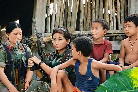 Local children with soldiers of People Liberation Army