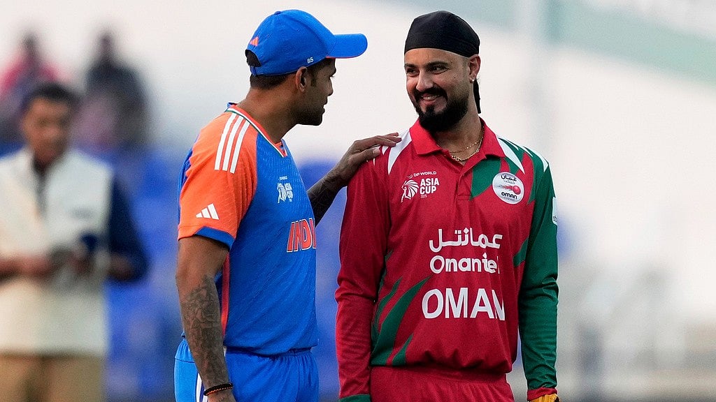 AP : India's captain Suryakumar Yadav, left, talks with Oman's Captain Jatinder Singh before the toss for their Asia Cup 2025 clash in Abu Dhabi.