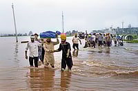 When The Five Rivers Turn Fierce: Punjab’s Floods And The 2025 Catastrophe Photo: PTI : Water, Water Everywhere: Locals assist in moving flood affected people to a safer place as floodwater enters villages in Ajnala, near Amritsar