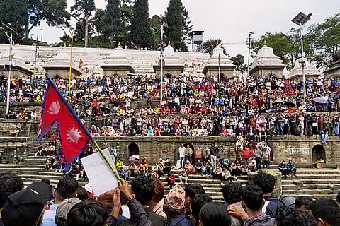 A crowd gathers at a funeral in Pashupatinath Temple in Kathmandu