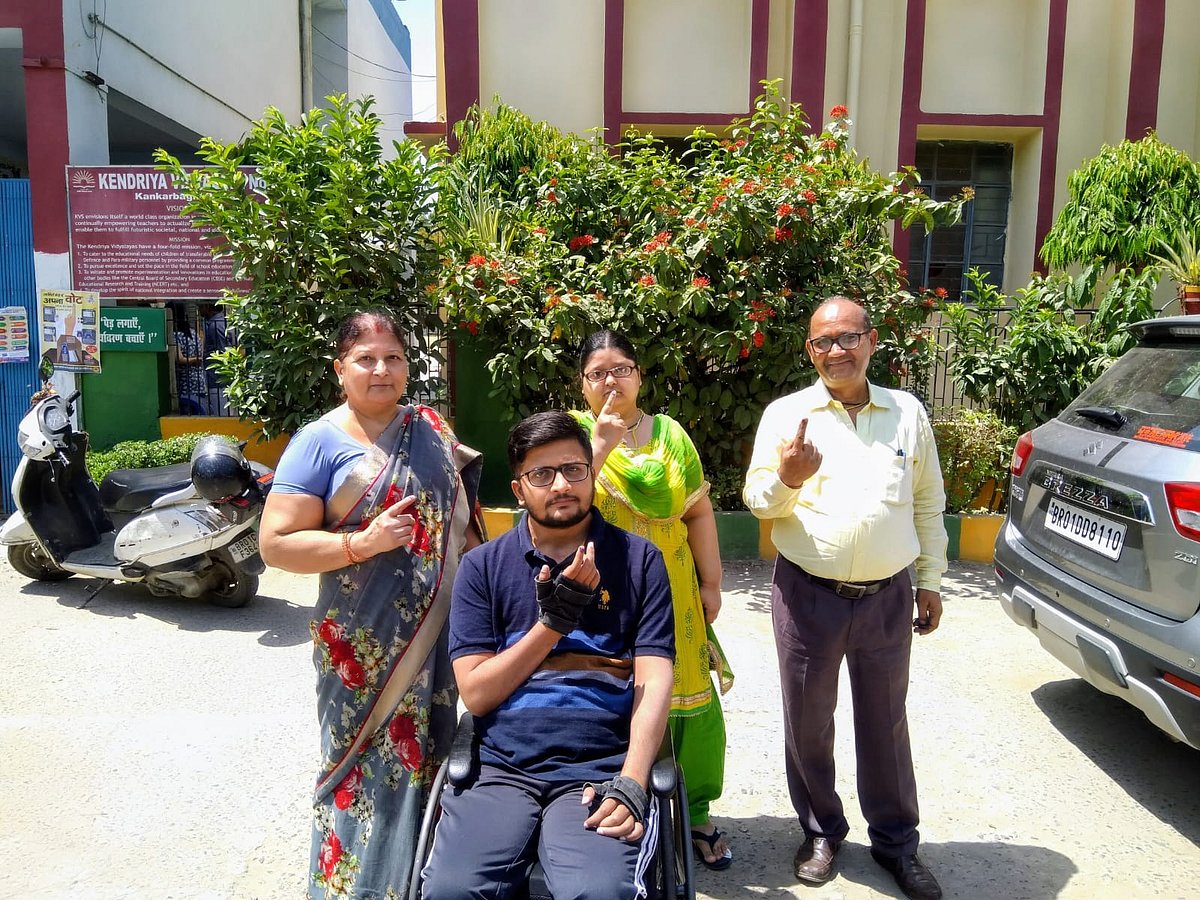 | file pic | :  Anurag with his parents and sister after casting their votes  
