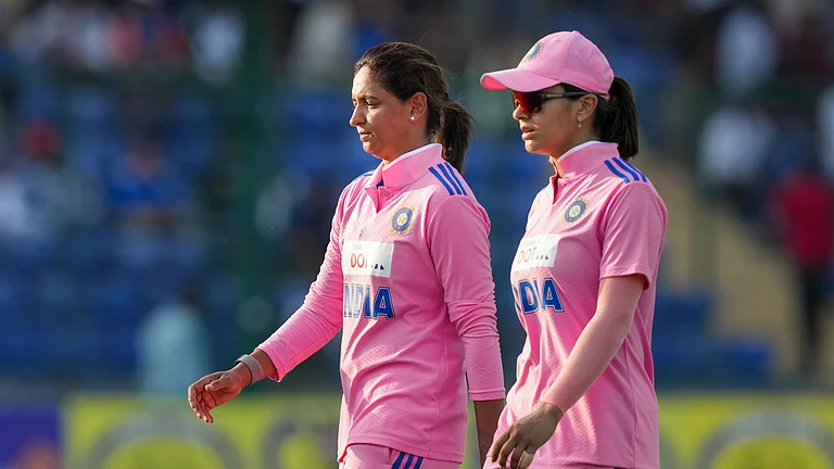 India Women  Vs Australia Women Live Score, 3rd ODI Updates: India's captain Harmanpreet Kaur, left, and Harleen Deol walk towards the pavilion after the end of Australia's innings. - (PTI Photo/Atul Yadav)