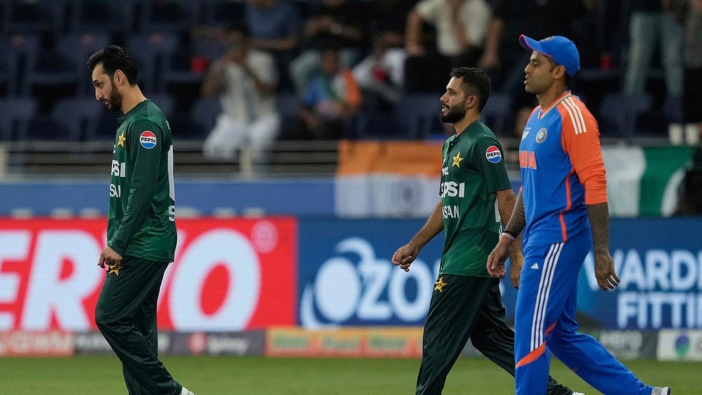 Pakistans captain Salman Agha, Indias captain Suryakumar Yadav, walk in ground in Asia Cup 2025