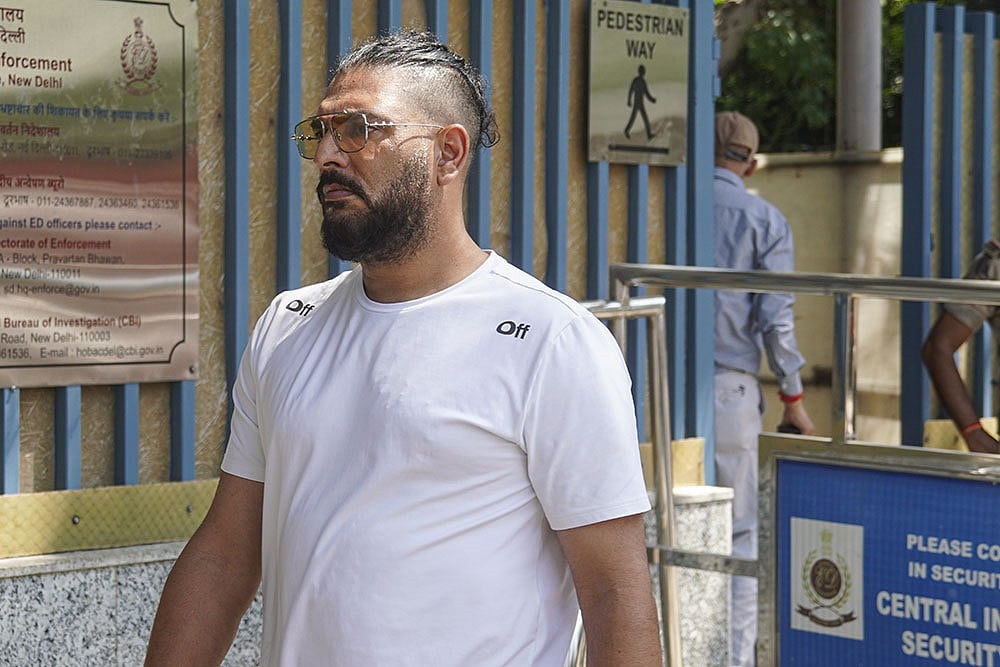 Photo: PTI : Former cricketer Yuvraj Singh arrives to appear before the Enforcement Directorate (ED) for questioning in a money laundering case linked to an online betting app named 1xBet, in New Delhi