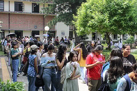 Students at Miranda House, Delhi University, stand in a line to vote for 2025 DUSU elections