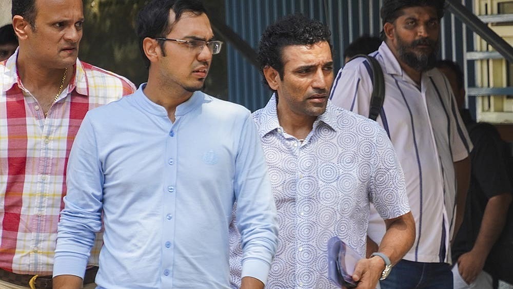  Photo: PTI : Former cricketer Robin Uthappa, front right, arrives to appear before the Enforcement Directorate (ED) for questioning in a money laundering case linked to an online betting app, at ED office, in New Delhi.